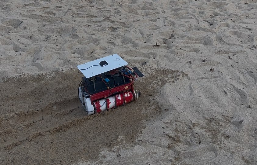 MAARCO’s twin-screw rover leaving tracks during a sand test.